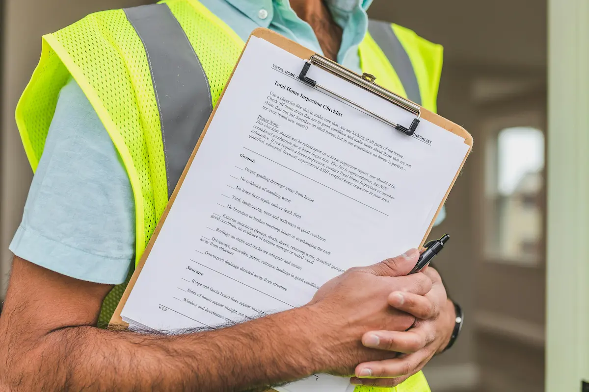 Home inspector performing inspection